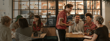 Stock image of people being serviced in a restaurant